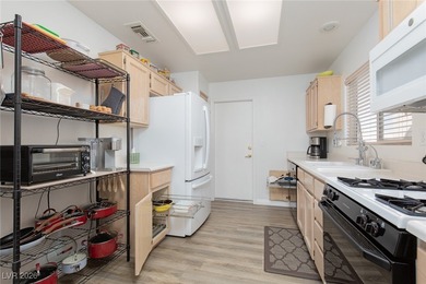 Welcome home to this cozy 2-bedroom, 2-bath townhome nestled in on Highland Falls Golf Club in Nevada - for sale on GolfHomes.com, golf home, golf lot