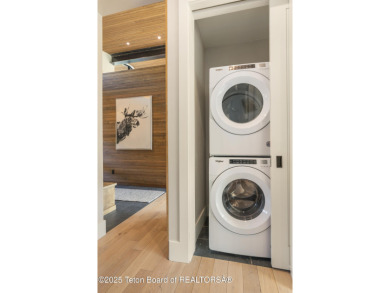 Experience mountain modern luxury in this stunning one-level, 4 on Snake River Sporting Club in Wyoming - for sale on GolfHomes.com, golf home, golf lot