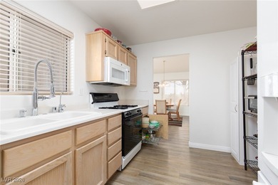 Welcome home to this cozy 2-bedroom, 2-bath townhome nestled in on Highland Falls Golf Club in Nevada - for sale on GolfHomes.com, golf home, golf lot