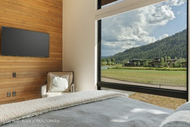 Experience mountain modern luxury in this stunning one-level, 4 on Snake River Sporting Club in Wyoming - for sale on GolfHomes.com, golf home, golf lot