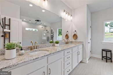 Nestled in the sought-after Traditions of Braselton community on Traditions of Braselton Golf Club in Georgia - for sale on GolfHomes.com, golf home, golf lot