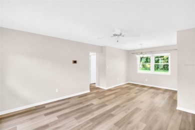Welcome to this beautifully updated 2-bedroom, 1.5-bath home on Highland Lakes Executive Golf Course in Florida - for sale on GolfHomes.com, golf home, golf lot