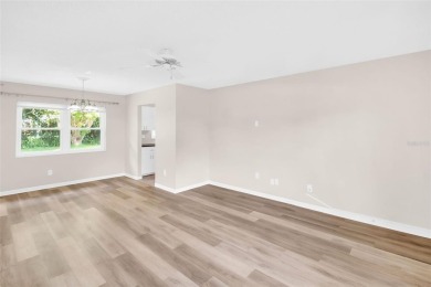 Welcome to this beautifully updated 2-bedroom, 1.5-bath home on Highland Lakes Executive Golf Course in Florida - for sale on GolfHomes.com, golf home, golf lot