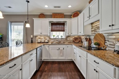Curb appeal, low maintenance, attention to detail, and a high on Cape Fear National At Brunswick Forest in North Carolina - for sale on GolfHomes.com, golf home, golf lot