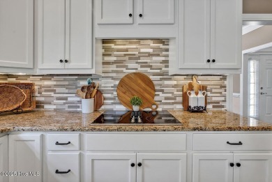 Curb appeal, low maintenance, attention to detail, and a high on Cape Fear National At Brunswick Forest in North Carolina - for sale on GolfHomes.com, golf home, golf lot