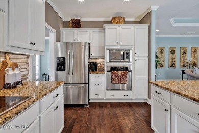 Curb appeal, low maintenance, attention to detail, and a high on Cape Fear National At Brunswick Forest in North Carolina - for sale on GolfHomes.com, golf home, golf lot