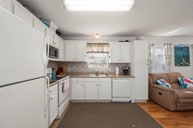 Rare opportunity to own a furnished 2-bedroom, 2-bath singlewide on Kings Gate Golf Club in Florida - for sale on GolfHomes.com, golf home, golf lot