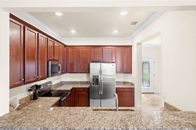 Welcome to Marbella! This well-maintained townhome impresses on Heritage Palms Golf and Country Club in Florida - for sale on GolfHomes.com, golf home, golf lot