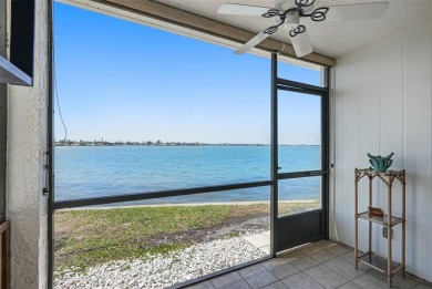 MILLION DOLLAR WATER VIEWS! From the moment you enter this on Isla Del Sol Yacht and Country Club in Florida - for sale on GolfHomes.com, golf home, golf lot
