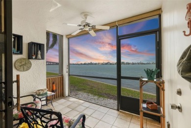 MILLION DOLLAR WATER VIEWS! From the moment you enter this on Isla Del Sol Yacht and Country Club in Florida - for sale on GolfHomes.com, golf home, golf lot