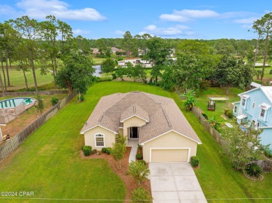 Experience unparalleled luxury with this bespoke residence by on Holiday Golf Club in Florida - for sale on GolfHomes.com, golf home, golf lot