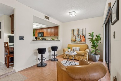 GOLF COURSE VIEWS! Desirable CARROLLWOOD VILLAGE condo/townhome on Carrollwood Country Club in Florida - for sale on GolfHomes.com, golf home, golf lot