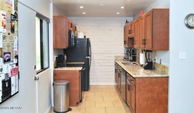 Lovely light and bright 2 bed/2bath corner, upstairs condominium on Oro Valley Country Club in Arizona - for sale on GolfHomes.com, golf home, golf lot