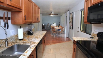 Lovely light and bright 2 bed/2bath corner, upstairs condominium on Oro Valley Country Club in Arizona - for sale on GolfHomes.com, golf home, golf lot