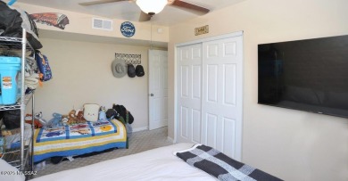 Lovely light and bright 2 bed/2bath corner, upstairs condominium on Oro Valley Country Club in Arizona - for sale on GolfHomes.com, golf home, golf lot