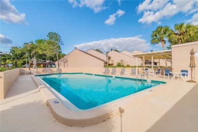 GOLF COURSE VIEWS! Desirable CARROLLWOOD VILLAGE condo/townhome on Carrollwood Country Club in Florida - for sale on GolfHomes.com, golf home, golf lot