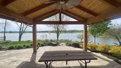 Welcome home to this beautiful, updated, unique charming rustic on Lakes of the Four Seasons Country Club in Indiana - for sale on GolfHomes.com, golf home, golf lot