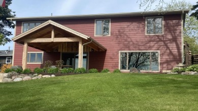 Welcome home to this beautiful, updated, unique charming rustic on Lakes of the Four Seasons Country Club in Indiana - for sale on GolfHomes.com, golf home, golf lot