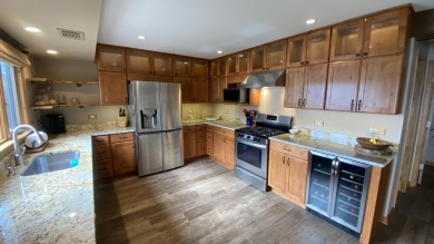 Welcome home to this beautiful, updated, unique charming rustic on Lakes of the Four Seasons Country Club in Indiana - for sale on GolfHomes.com, golf home, golf lot