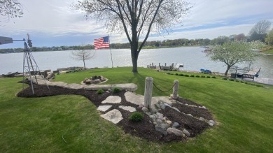 Welcome home to this beautiful, updated, unique charming rustic on Lakes of the Four Seasons Country Club in Indiana - for sale on GolfHomes.com, golf home, golf lot