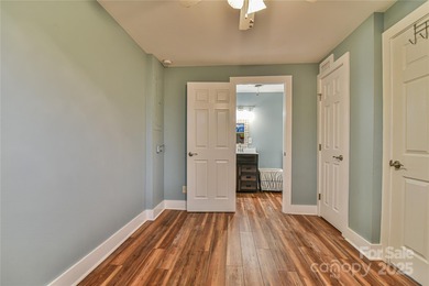 A Sunlit Corner Retreat in The Lynx - Wrapped in Woods, Light on Black Mountain Golf Course in North Carolina - for sale on GolfHomes.com, golf home, golf lot