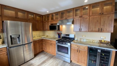 Welcome home to this beautiful, updated, unique charming rustic on Lakes of the Four Seasons Country Club in Indiana - for sale on GolfHomes.com, golf home, golf lot