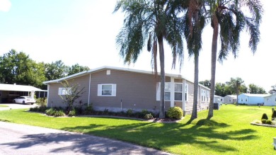 Here is your gorgeous triple-wide dream home on a corner lot on Schalamar Creek Golf and Country Club in Florida - for sale on GolfHomes.com, golf home, golf lot