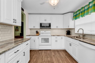 NICELY UPDATED and VERY WELL MAINTAINED Sheffield model with on Kings Gate Golf Club in Florida - for sale on GolfHomes.com, golf home, golf lot