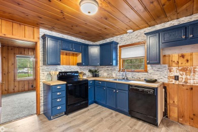 This charming cabin-style family home has been completely redone on All Vets Golf Club in Iowa - for sale on GolfHomes.com, golf home, golf lot