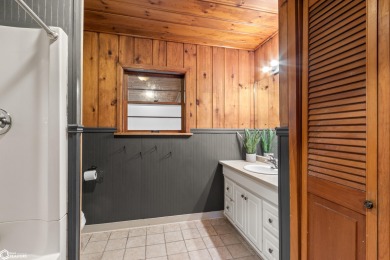 This charming cabin-style family home has been completely redone on All Vets Golf Club in Iowa - for sale on GolfHomes.com, golf home, golf lot