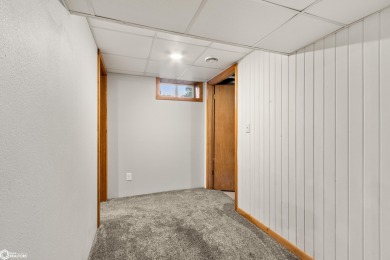 This charming cabin-style family home has been completely redone on All Vets Golf Club in Iowa - for sale on GolfHomes.com, golf home, golf lot