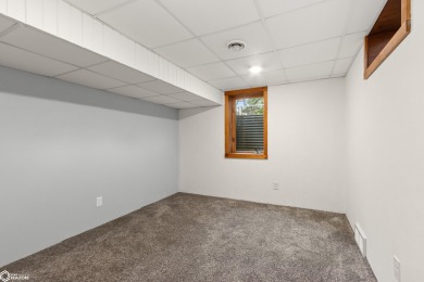 This charming cabin-style family home has been completely redone on All Vets Golf Club in Iowa - for sale on GolfHomes.com, golf home, golf lot
