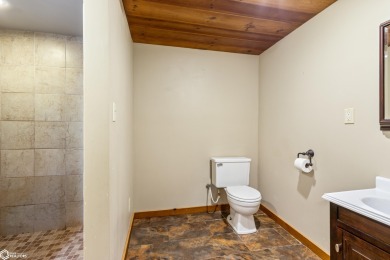 This charming cabin-style family home has been completely redone on All Vets Golf Club in Iowa - for sale on GolfHomes.com, golf home, golf lot