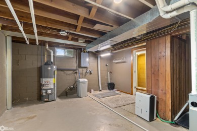 This charming cabin-style family home has been completely redone on All Vets Golf Club in Iowa - for sale on GolfHomes.com, golf home, golf lot