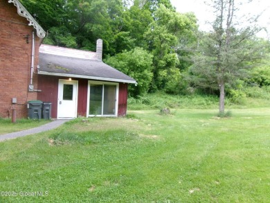 This is a Unique home on a very private 2.5 acre lot offering on Hoosick Falls Country Club in New York - for sale on GolfHomes.com, golf home, golf lot