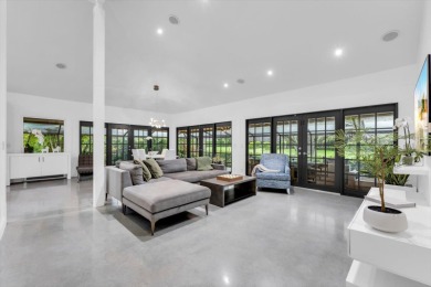 Bright and inviting, this 3-bedroom, 3-bath bungalow offers on Palm Beach Polo and Country Club in Florida - for sale on GolfHomes.com, golf home, golf lot
