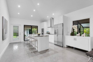 Bright and inviting, this 3-bedroom, 3-bath bungalow offers on Palm Beach Polo and Country Club in Florida - for sale on GolfHomes.com, golf home, golf lot