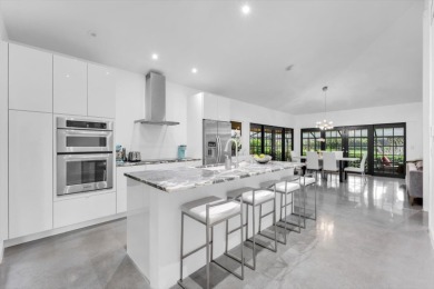 Bright and inviting, this 3-bedroom, 3-bath bungalow offers on Palm Beach Polo and Country Club in Florida - for sale on GolfHomes.com, golf home, golf lot