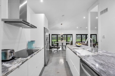 Bright and inviting, this 3-bedroom, 3-bath bungalow offers on Palm Beach Polo and Country Club in Florida - for sale on GolfHomes.com, golf home, golf lot