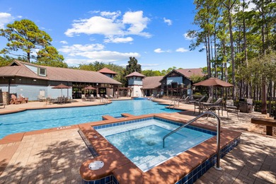 Tucked within the private gates of Wild Heron, 1203 W Water Oak on Sharks Tooth Golf Club in Florida - for sale on GolfHomes.com, golf home, golf lot