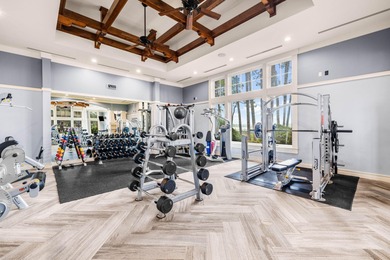 Tucked within the private gates of Wild Heron, 1203 W Water Oak on Sharks Tooth Golf Club in Florida - for sale on GolfHomes.com, golf home, golf lot