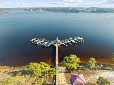 Tucked within the private gates of Wild Heron, 1203 W Water Oak on Sharks Tooth Golf Club in Florida - for sale on GolfHomes.com, golf home, golf lot