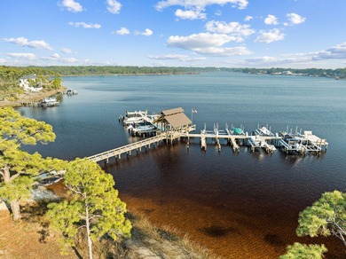 Tucked within the private gates of Wild Heron, 1203 W Water Oak on Sharks Tooth Golf Club in Florida - for sale on GolfHomes.com, golf home, golf lot