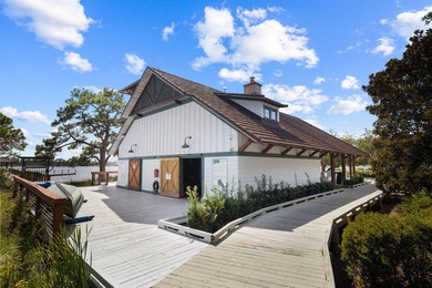 Tucked within the private gates of Wild Heron, 1203 W Water Oak on Sharks Tooth Golf Club in Florida - for sale on GolfHomes.com, golf home, golf lot