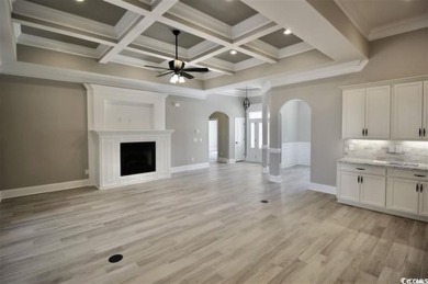 This brand-new custom home boasts 5 spacious bedrooms and 4 on Wild Wing Plantation in South Carolina - for sale on GolfHomes.com, golf home, golf lot