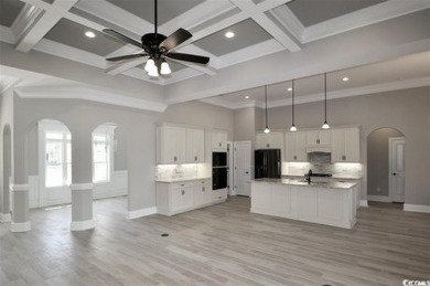 This brand-new custom home boasts 5 spacious bedrooms and 4 on Wild Wing Plantation in South Carolina - for sale on GolfHomes.com, golf home, golf lot