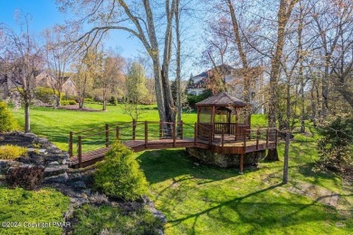 Discover the pinnacle of luxury in the Pocono Mountains of on Great Bear Golf and Country Club in Pennsylvania - for sale on GolfHomes.com, golf home, golf lot