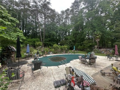 This spacious 5-bedroom, 3.5-bath brick home offers strong bones on Canongate At Flat Creek Club in Georgia - for sale on GolfHomes.com, golf home, golf lot