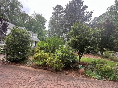 This spacious 5-bedroom, 3.5-bath brick home offers strong bones on Canongate At Flat Creek Club in Georgia - for sale on GolfHomes.com, golf home, golf lot