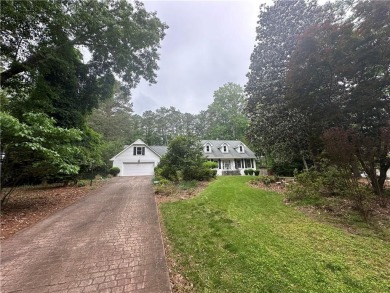 This spacious 5-bedroom, 3.5-bath brick home offers strong bones on Canongate At Flat Creek Club in Georgia - for sale on GolfHomes.com, golf home, golf lot